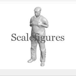 F113 - Worker standing, with thumbs hooked into braces.